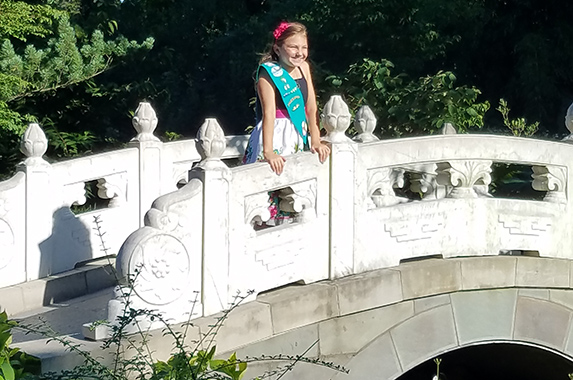 Girl Scout on bridge